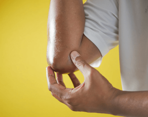 A person holds their elbow on each side.